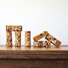 Miso Blondie with white chocolate drizzle in portions arranged like Stonehenge