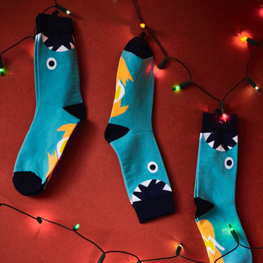 Exploding Bakery Socks hung up on Christmas lights