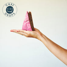 A slice of Blueberry Cake in the palm of a hand