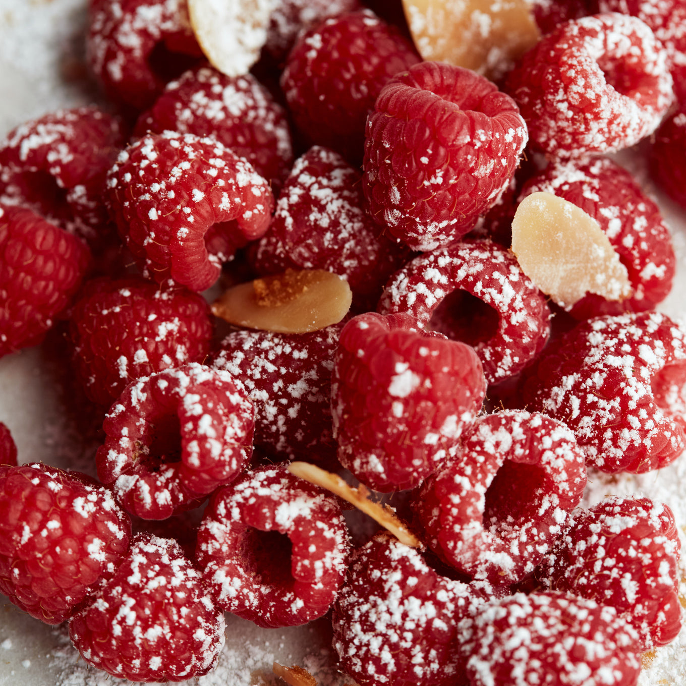 Raspberries with flaked almonds.