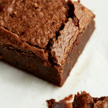 An Exploding Bakery Almond Brownie Traybake portion close up.