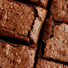 Exploding Bakery Almond Brownie Traybake portions close up.