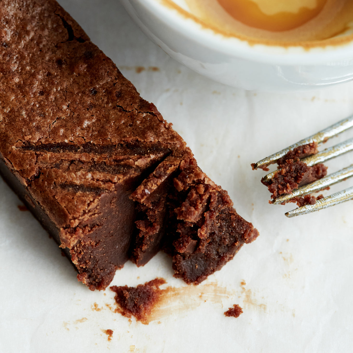 An Exploding Bakery Almond Brownie Traybake portion with fork.