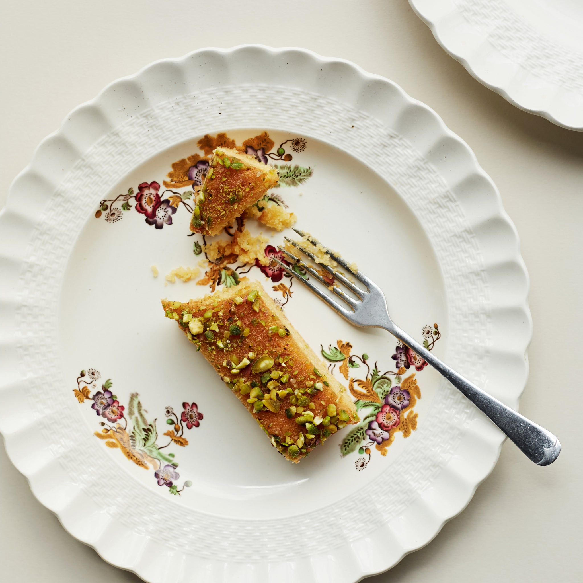 Lemon Polenta & Pistachio Traybake portion on plate.