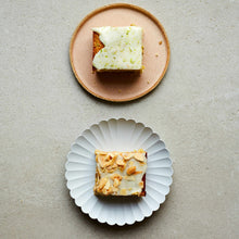 Two Slices Of Cake On Separate Plates