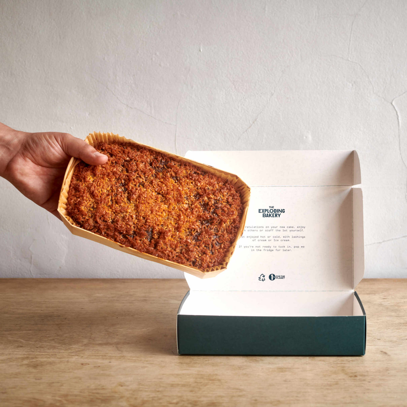 Exploding Bakery Lumberjack Cake being placed into a box.