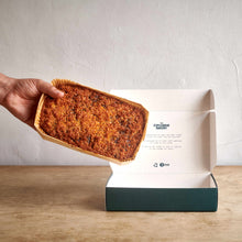 Exploding Bakery Lumberjack Cake being placed into a box.