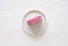 An Aerial Shot Of A Plated Slice Of Berry Citrus Cake