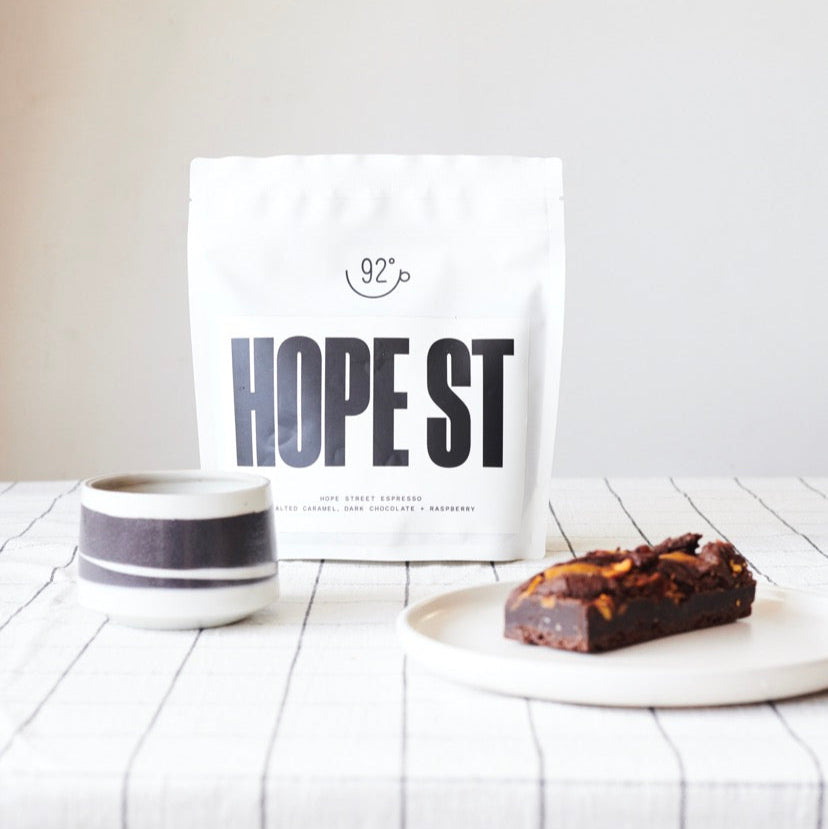 our Coffee and Cake Gift Box Photographed from the side on a table.