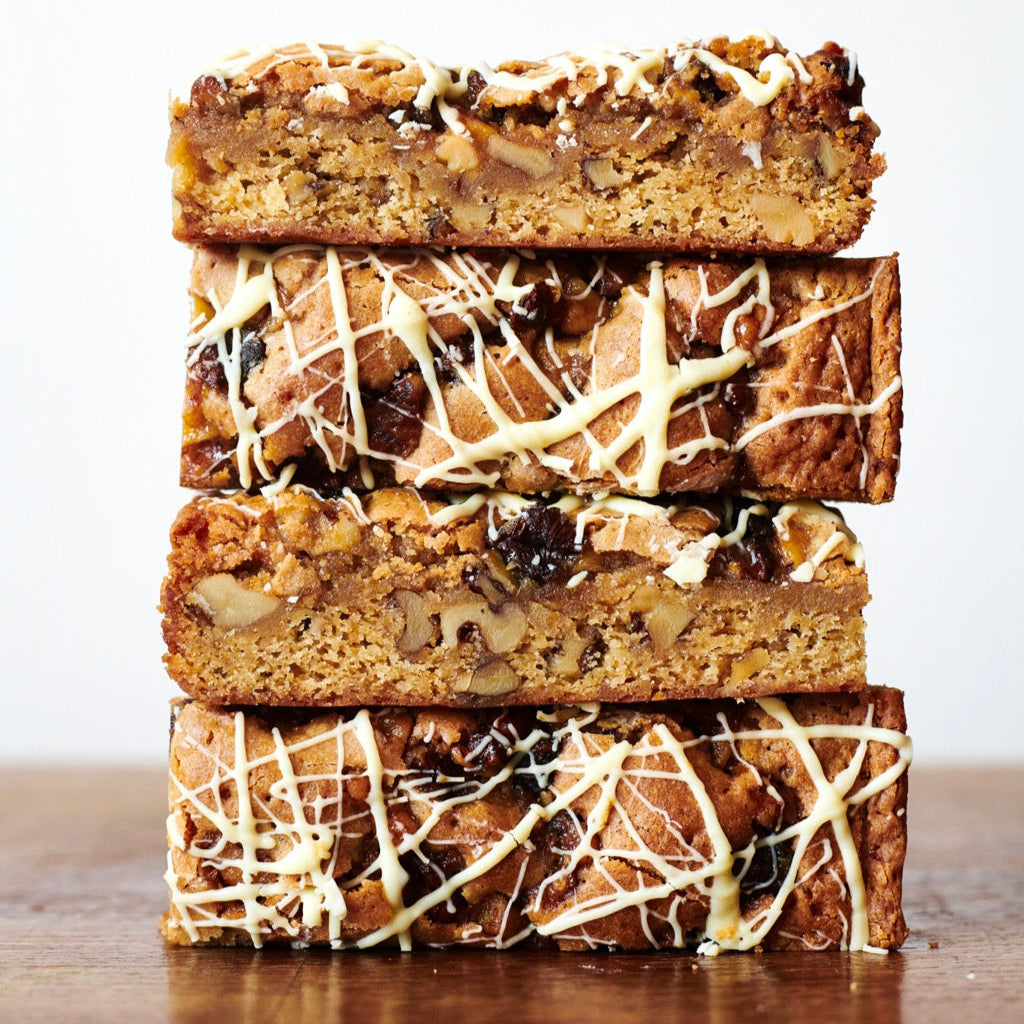 Stack of miso blondie slices on a wooden table