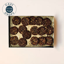 Hazelnut, Miso & White Chocolate Cookies in a baking tray photographed from above