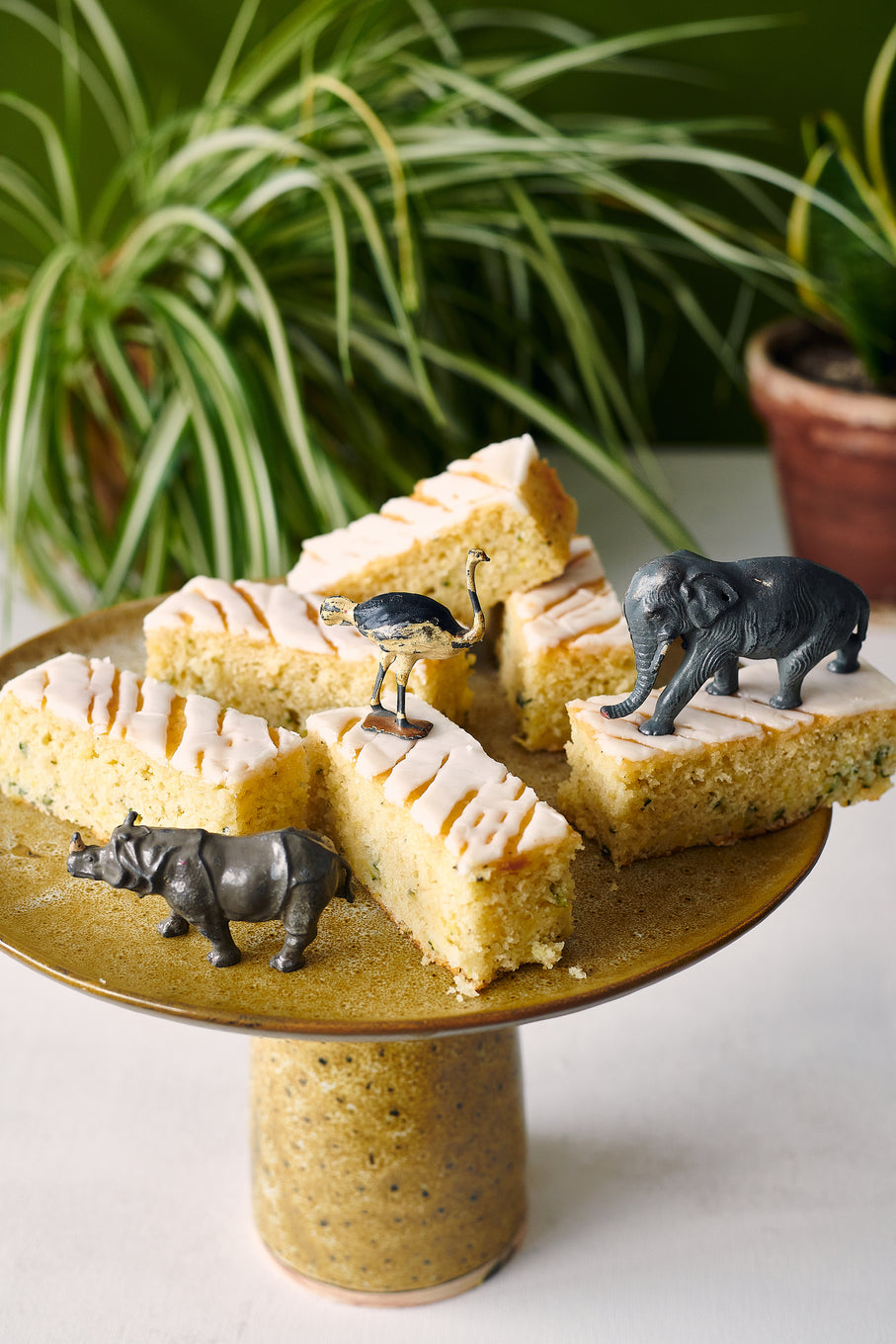 Exploding Bakery Zucchini, Lime and Rosemary slices on a cake stand