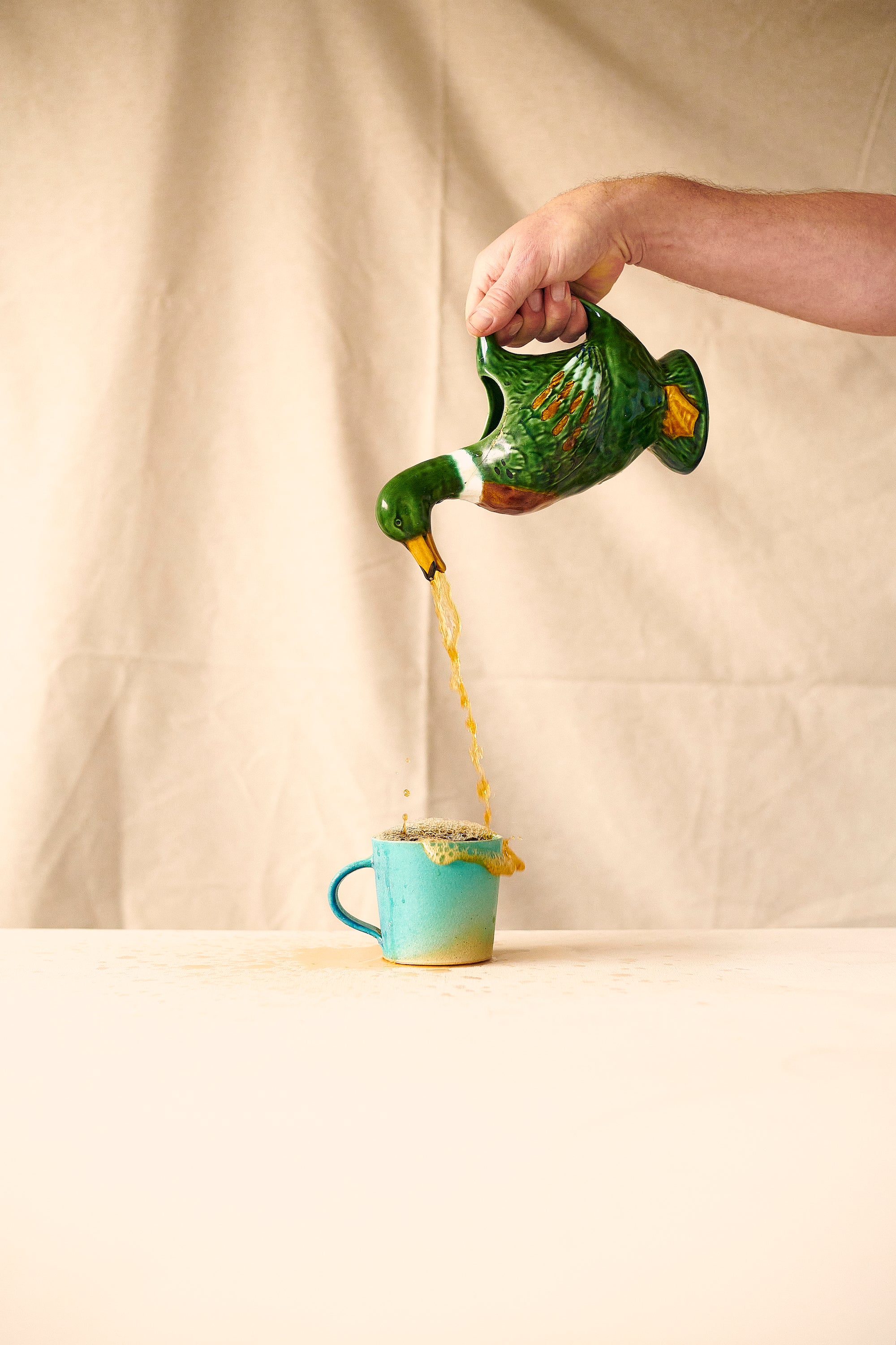Someone Pouring A Cup Of Canton Specialty Breakfast Tea