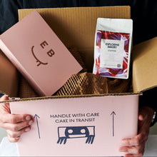 Tripple Co Coffee and a cake bundle in a box being held
