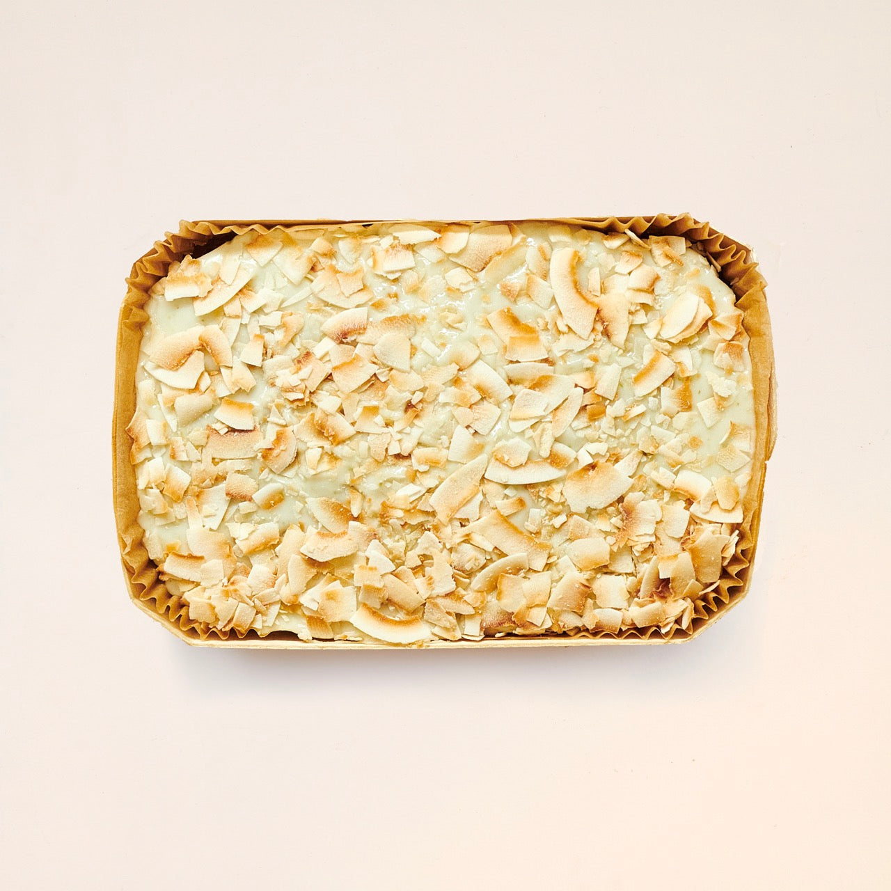 Hummingbird cake with pecans on top photographed from above