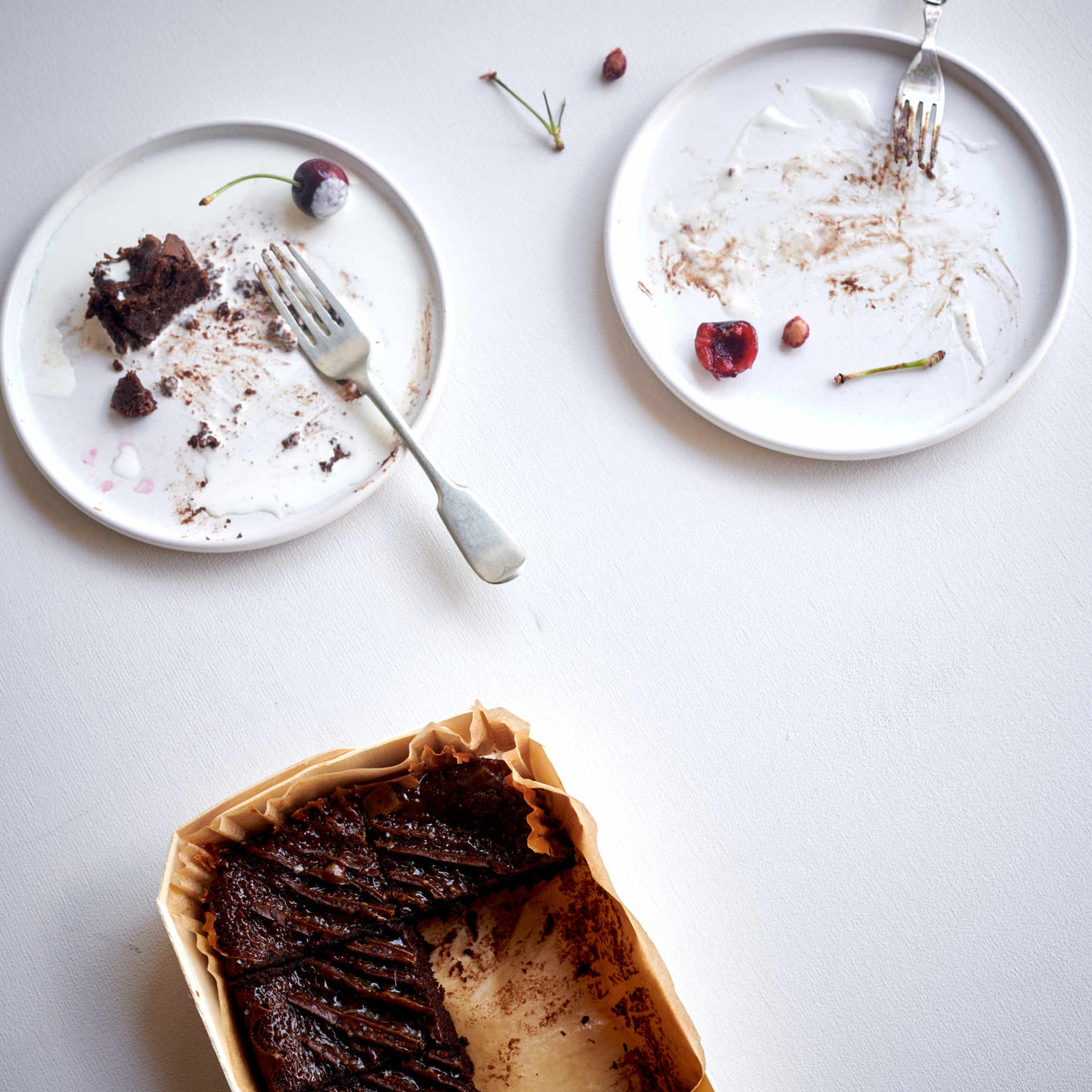 Exploding Bakery Salted Caramel Brownie served with cherries.